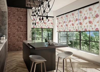Beautiful display of stylish roller blinds in a chic kitchen